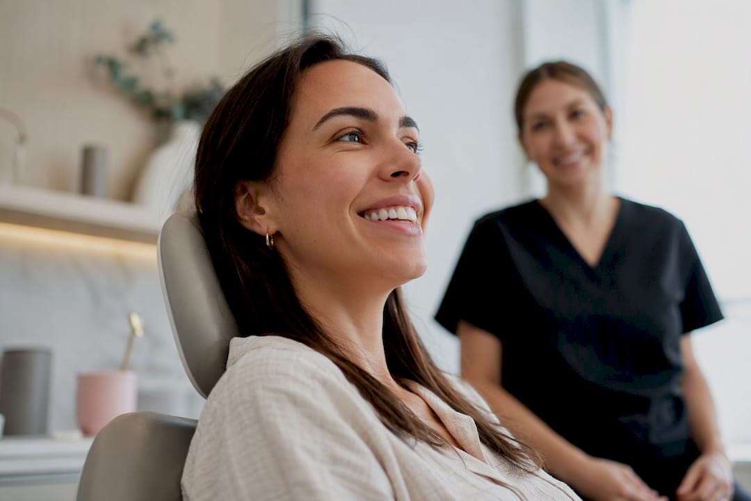 Woman smiling after braces removal