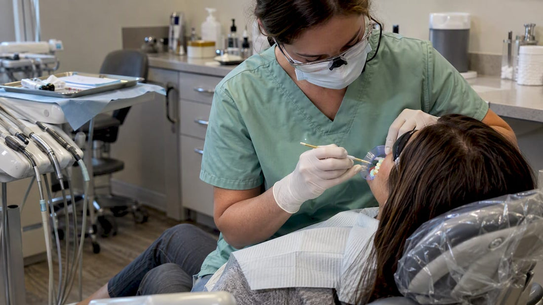 Clinician applying whitening gel during treatment